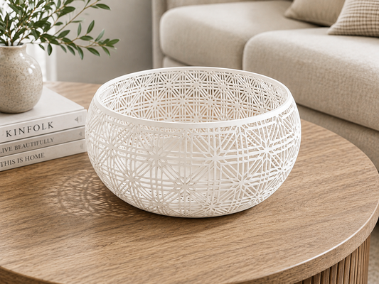 Filigree Bowl casting patterned shadows on a console