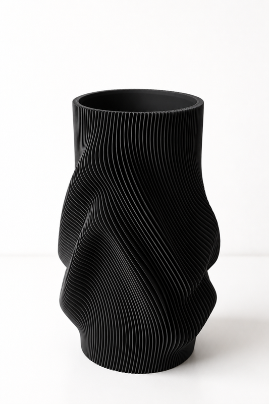 Swirl Vase styled with dried stems on a dining table